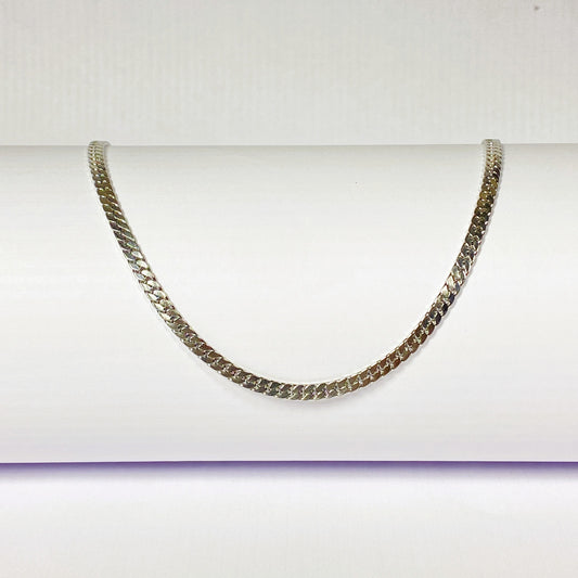Silver chain necklace on a white background